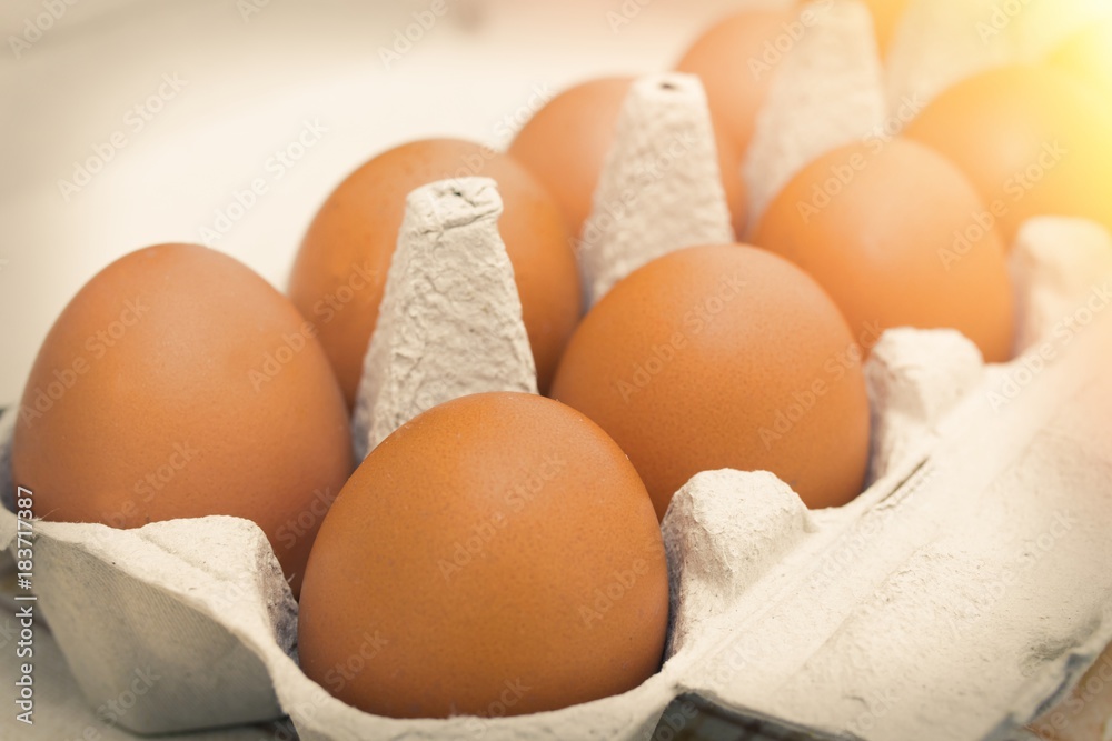 eggs in the foreground in the carton