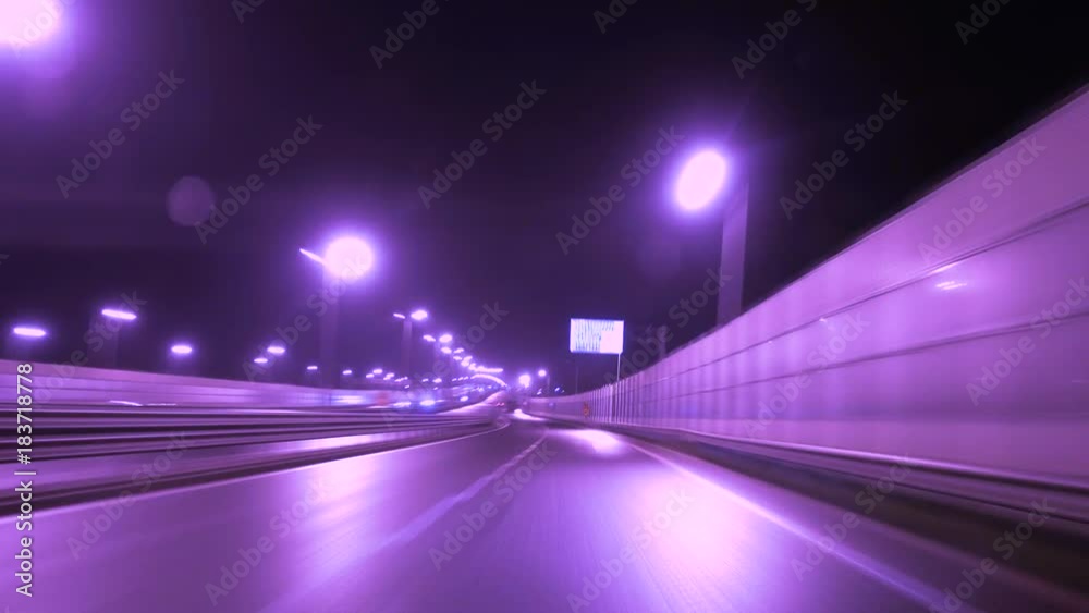 Time lapse of driving a car in the city at night time. POV.