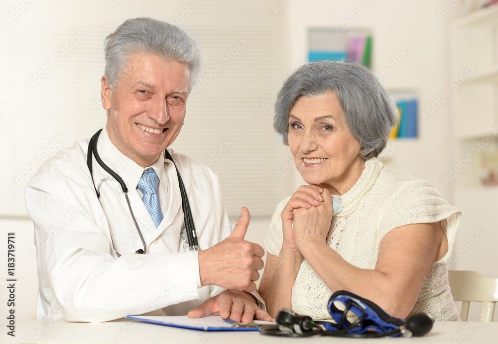 Senior doctor with elderly patient Senior doctor with elderly patient