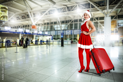 woman in red dress and sexy heels with suitcase 