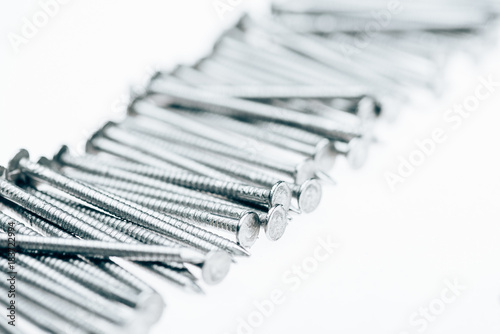 close up view of metal framing nails isolated on white