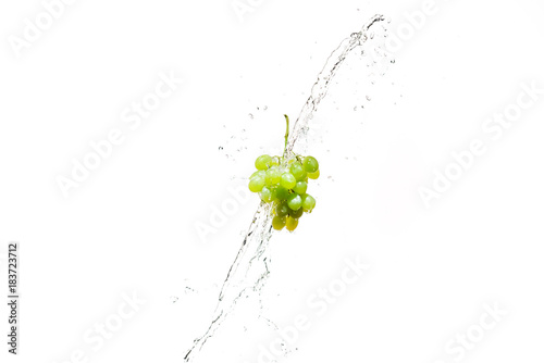  fresh grapes in water splashes isolated on white