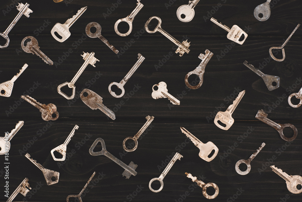 top view of different metal keys isolated on black