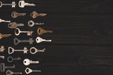 top view of different vintage keys isolated on black