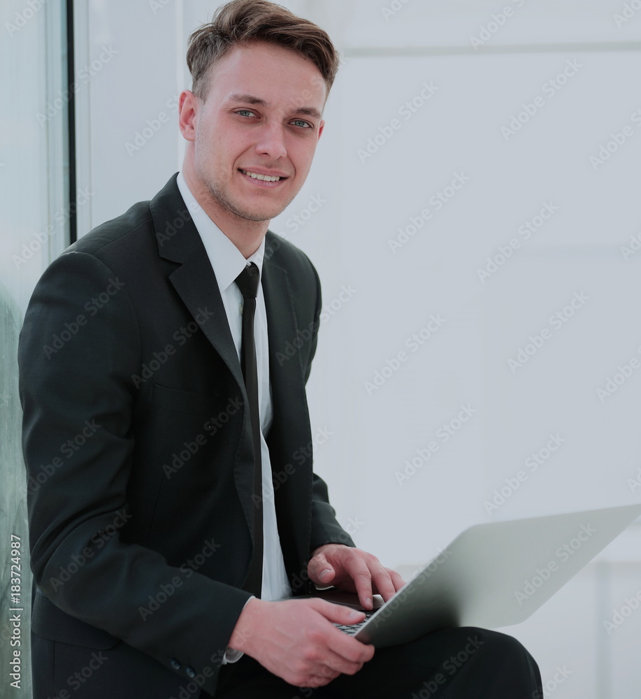 concept of the Internet: a successful student with laptop deals concept of the Internet: a successful student with laptop deals