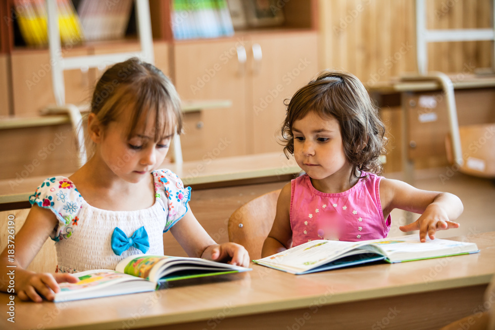 Fototapeta premium Preschool studying girls