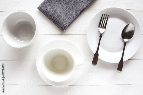 Design concept of mockup various kitchenware utensils set on white wooden table.