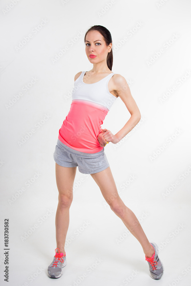 Woman in sportswear on a white background. Woman in sportswear on a white background.
