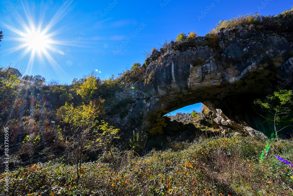 God's Bridge. The natural bridge from Ponoare is the largest natural bridge in the Romania and it is the second in Europe (30 m long, 13 m wide, 22 m high and 9 m thick) but the only circulated one