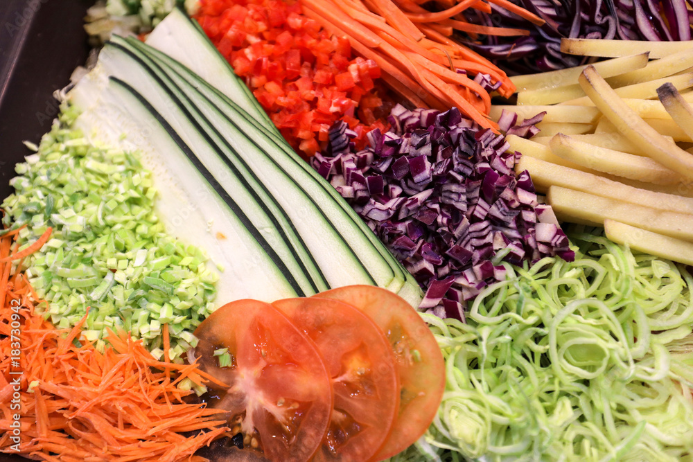 Different raw shredded vegetables as an example of a healthy diet