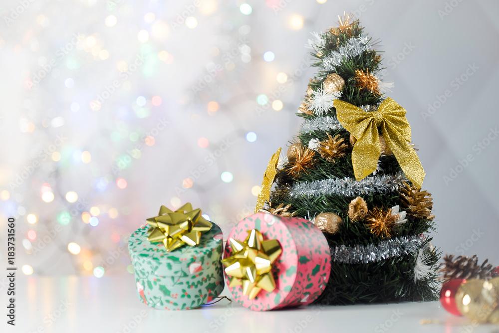 christmas decoration on bright background, gift boxes and tree