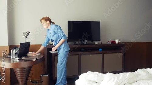 the maid steals money while cleaning the room in a five-star hotel. 4k. photo