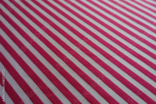 Close shot of diagonally striped fabric in pink and white