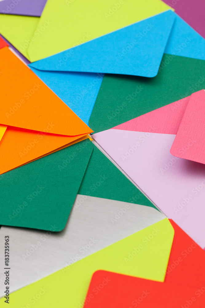Different colored envelopes on the desk Different colored envelopes on the desk