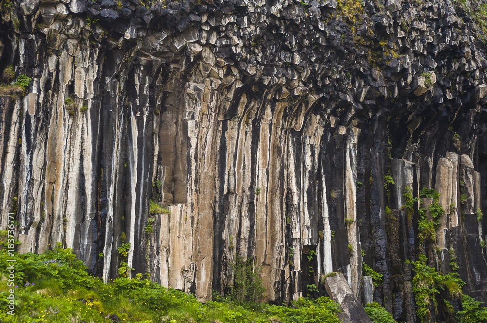 Icelandic rock formation/mind blowing rock formation in hexagonal pipe like form in the Icelandic landscape scenery.