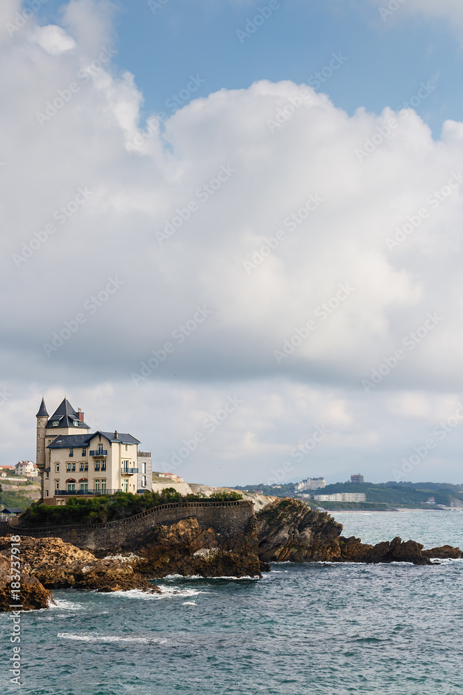 view of the Palace on the rocky beach against the blue sea and sky