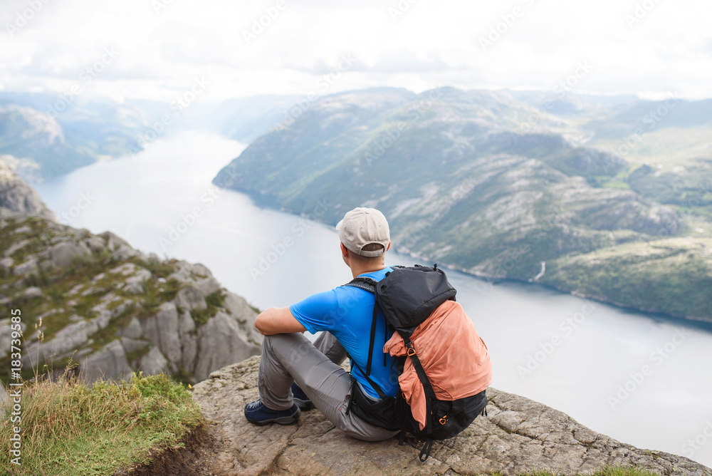 Relaxed Man on Top of Mountain