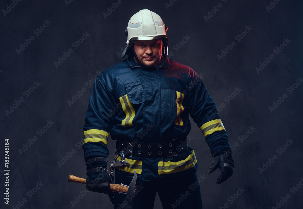 Fototapeta premium Firefighter holds the axe.