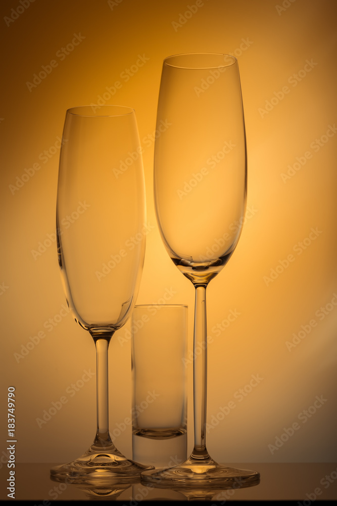 Champagne glass on yellow background