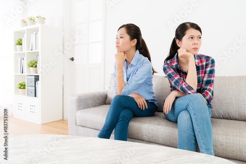 beautiful female friends having serious quarrel