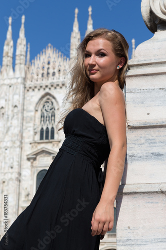 Beautiful happy girl in black dress over the famous Duomo Cathedral © Yevgeniy Zateychuk