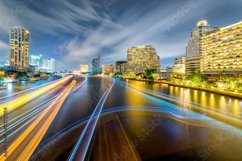 Light trails of traffic on the Chao Phraya river, Bangkok. Thailand. view from Taksin bridge Bangkok
