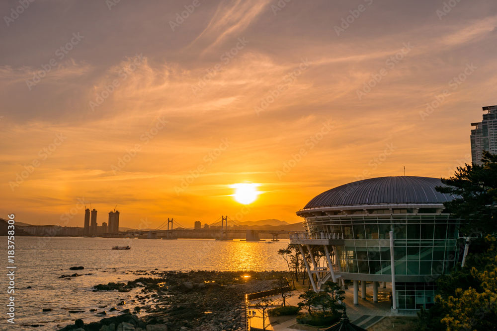 Busan Gwangan Bridge and Nurimaru APEC House sunset glow. StockFoto