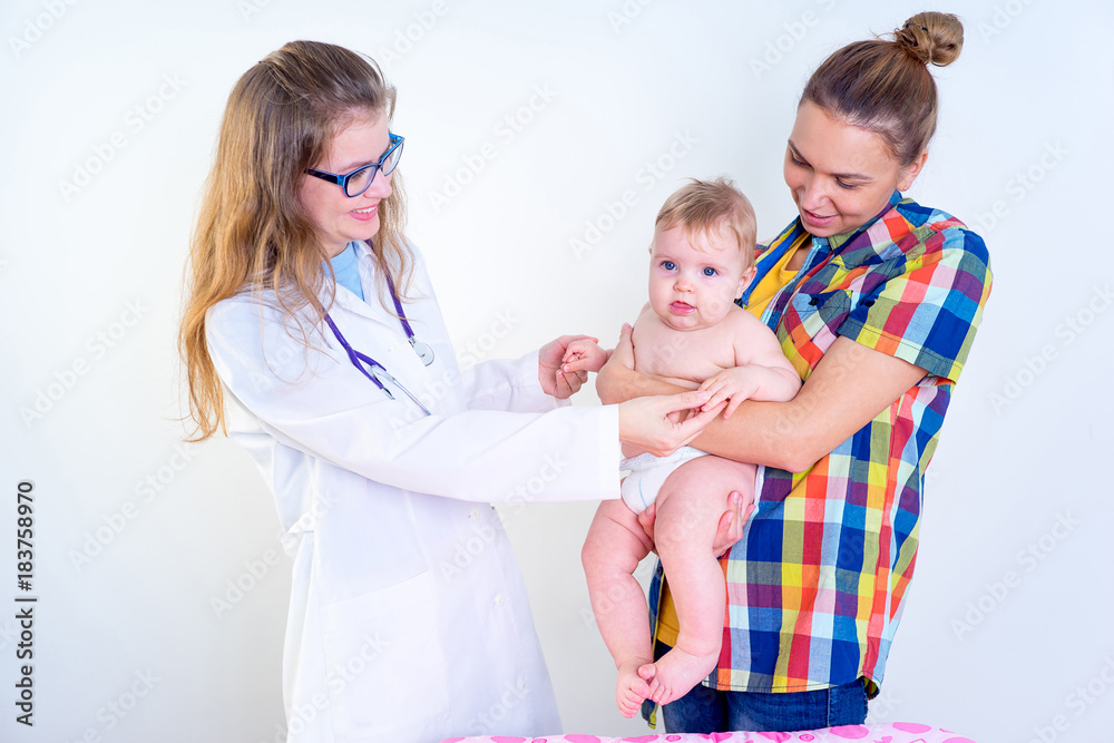 Pediatrician examining infant Pediatrician examining infant