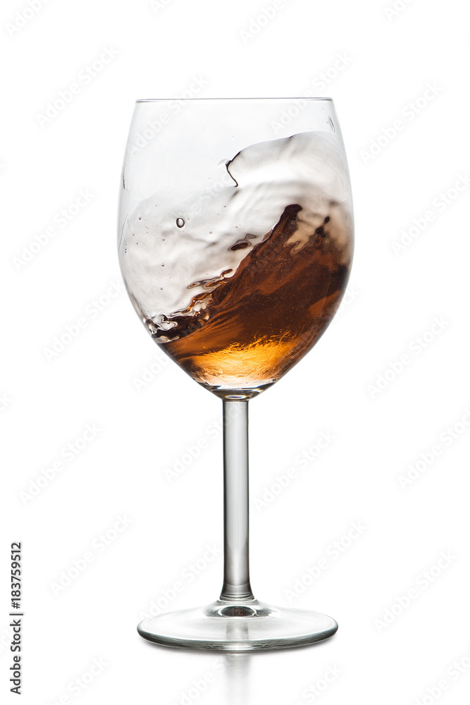 Splashing drink in glass Splashing drink in glass