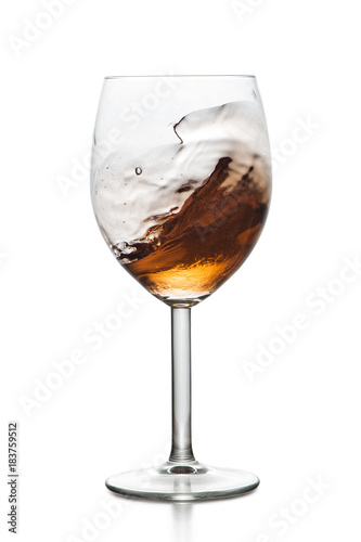 Splashing drink in glass