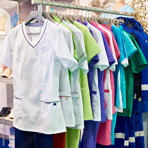 Medical gowns for nurses on hanger in store