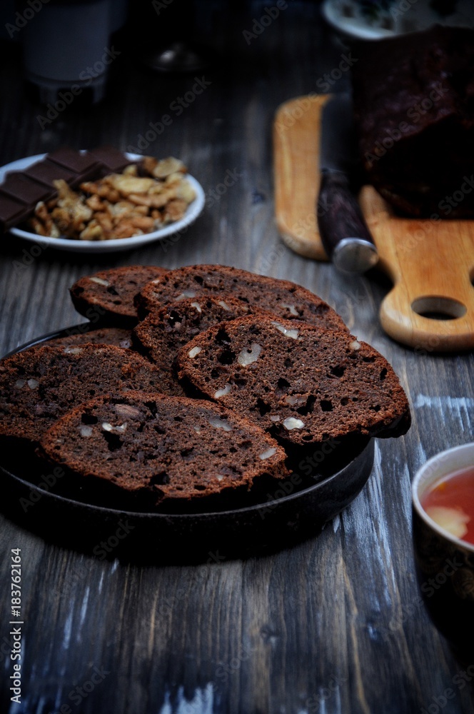 Fototapeta premium Chocolate cake with chunks of chocolate and nuts