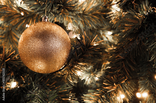 Golden Christmas ball in Christmas tree