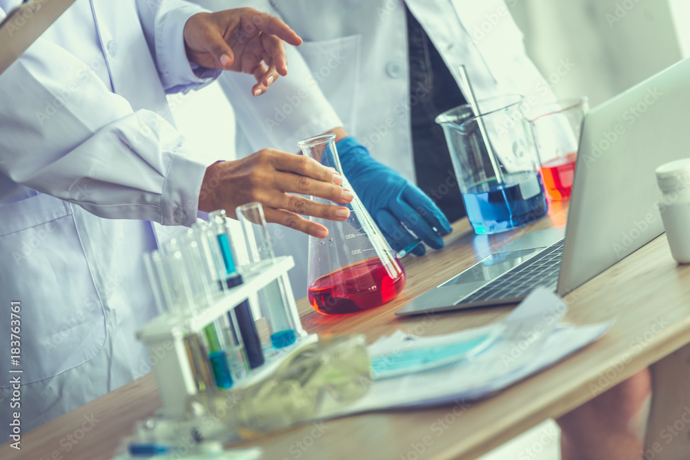 Fototapeta premium The medicals or scientific laboratory researcher performs tests with liquid in lab