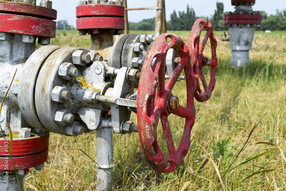 Manual shut-off valve on oil well. Oil well wellhead equipment. Manual shut-off valve on oil well. Oil well wellhead equipment.
