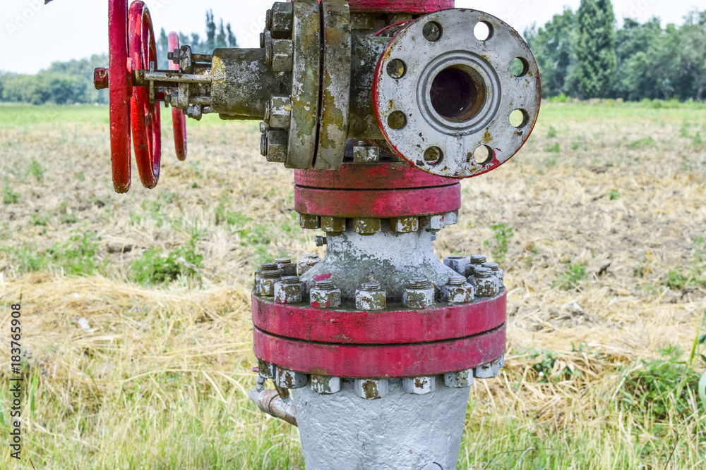 Manual shut-off valve on oil well. Oil well wellhead equipment. Manual shut-off valve on oil well. Oil well wellhead equipment.