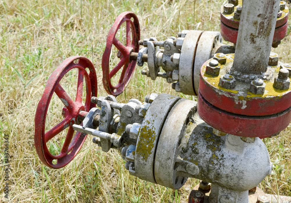 Manual shut-off valve on oil well. Oil well wellhead equipment. Manual shut-off valve on oil well. Oil well wellhead equipment.