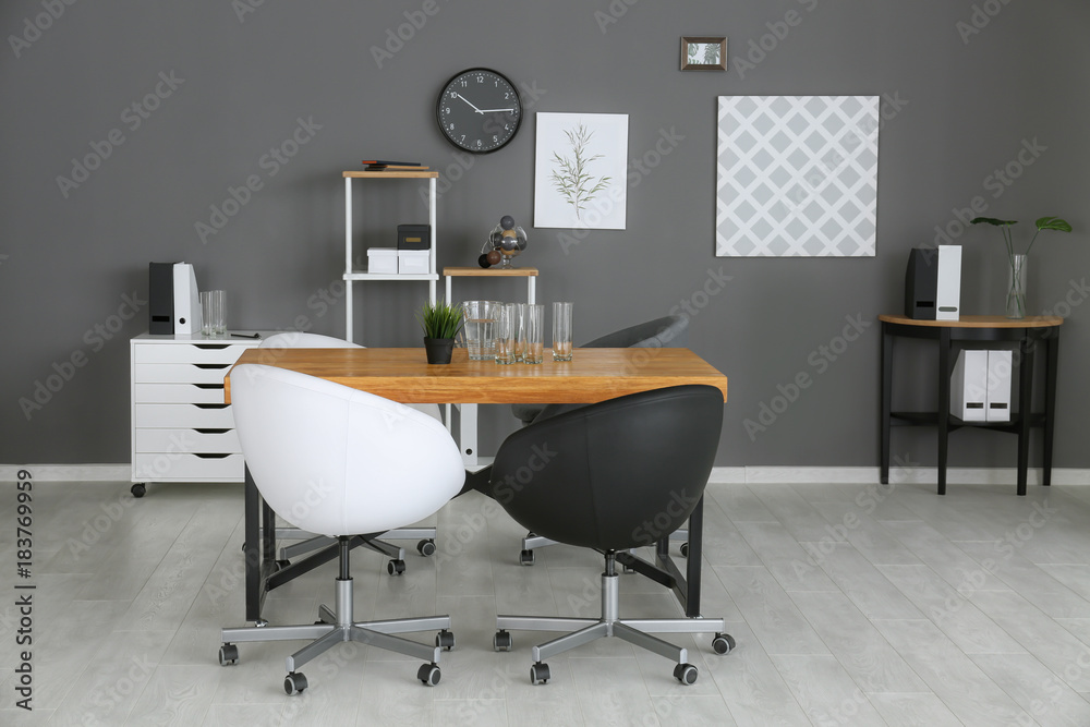 Modern office interior with black and white armchairs Modern office interior with black and white armchairs