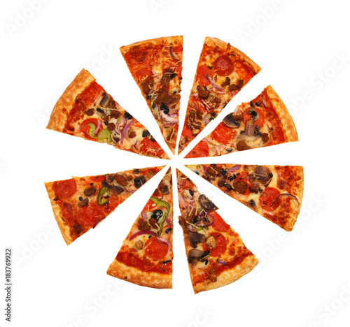 colorful tasty pizza with olives, pepperoni, ham and pepper, slices removed close-up shot, isolated on a white background