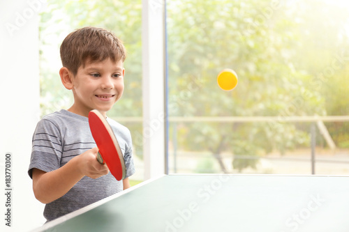 Cute little boy playing tab...