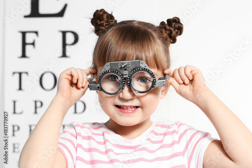 Cute little girl with trial...