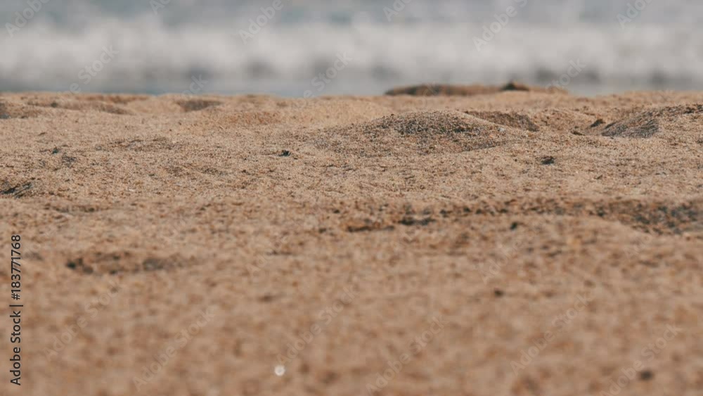 Yellow sand on background of blue waves of the Mediterranean Sea Yellow sand on background of blue waves of the Mediterranean Sea
