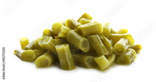 Heap of canned green beans on white background