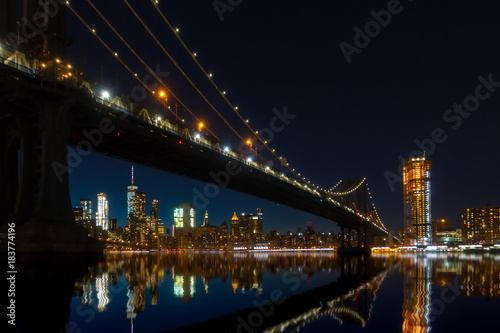 Fototapeta Naklejka Na Ścianę i Meble -  New York City Panoramic landscape view of Manhattan with famous Brooklyn Bridge by night.