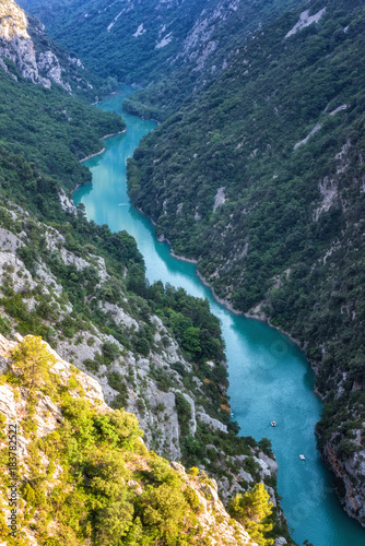 Verdon Gorge (Gorges du Verdon), amazing landscape of the famous canyon with winding turquoise-green colour river and high limestone rocks in French Alps, Provence, France, vertical image