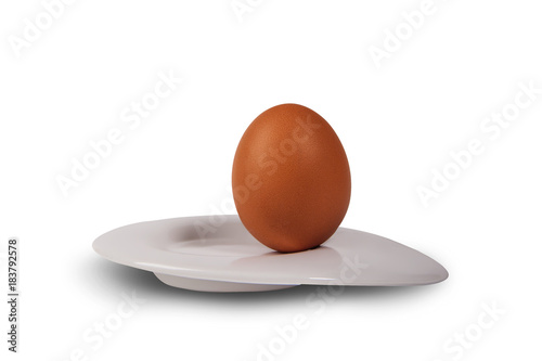 Fotografie yellow egg and white plate on a white