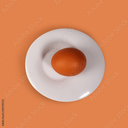 Slika na platnu yellow egg and white plate on a yellow