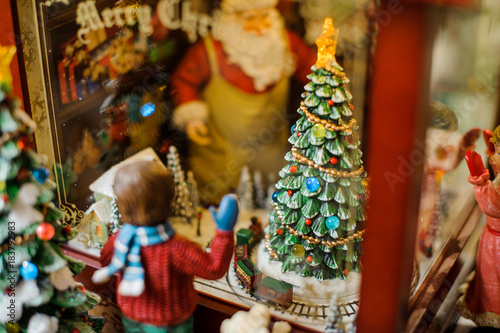 Christmas toy decorative composition consisting of a boy looking through the window