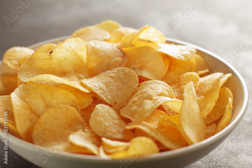 Big bowl of potato chips with crab taste on the table.