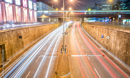 BERLIN - NOVEMBER 16, 2013: City traffic at night. Berlin attracts 15 million people every year